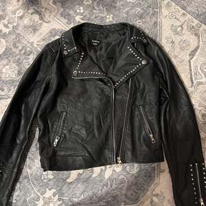 Bebe Women's Vegan Leather Studded Zipper Moto Jacket